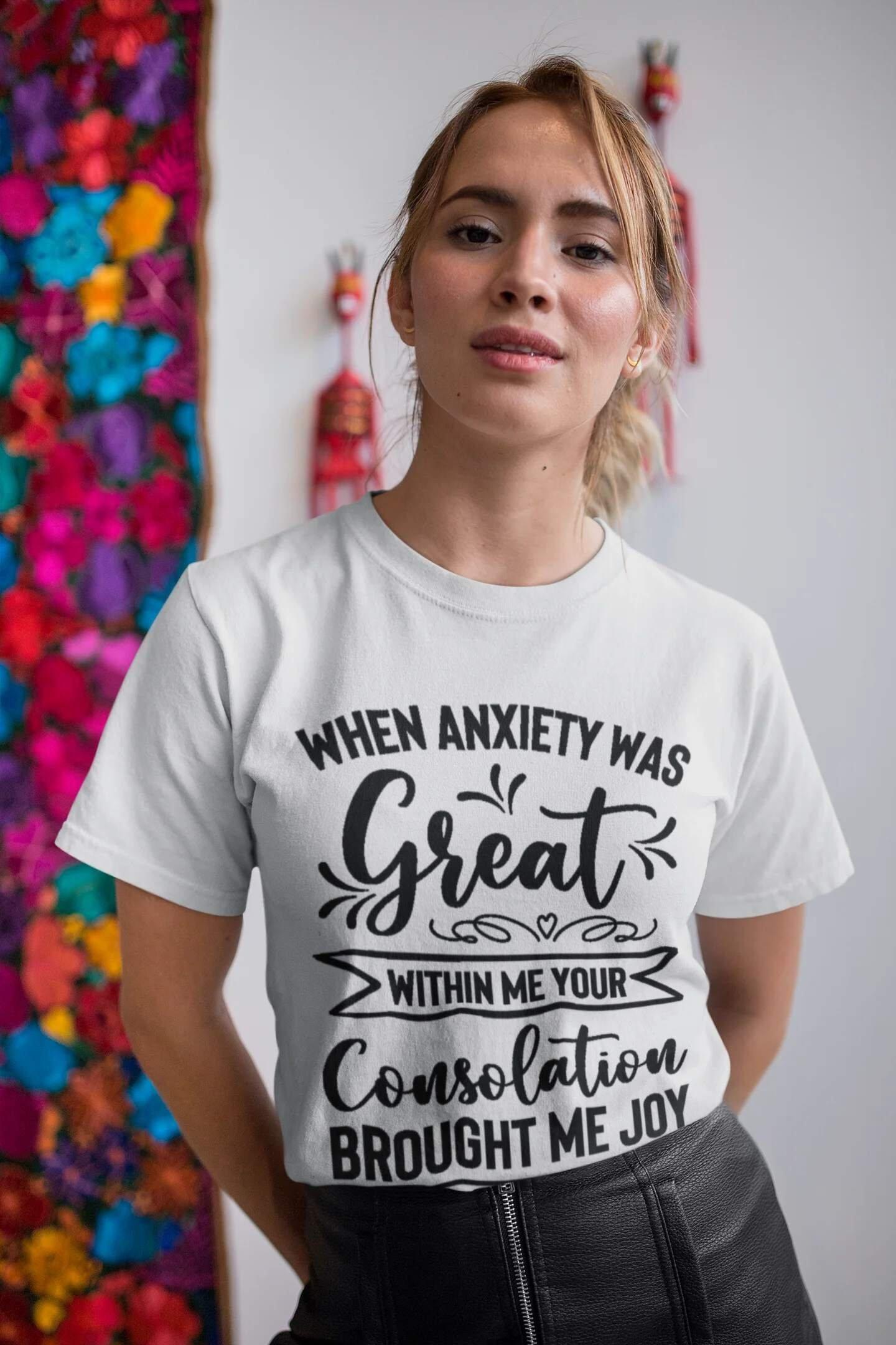 A woman wearing a shirt that reads: When anxiety was great within me, your consolation brought me joy